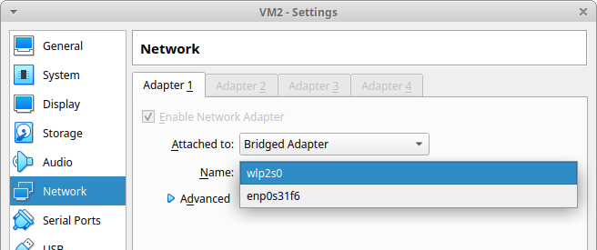 Screenshot of a VirtualBox Manager pop-up for a VM looking at network settings and listing the networks available (Wireless and wired Ethernet).
